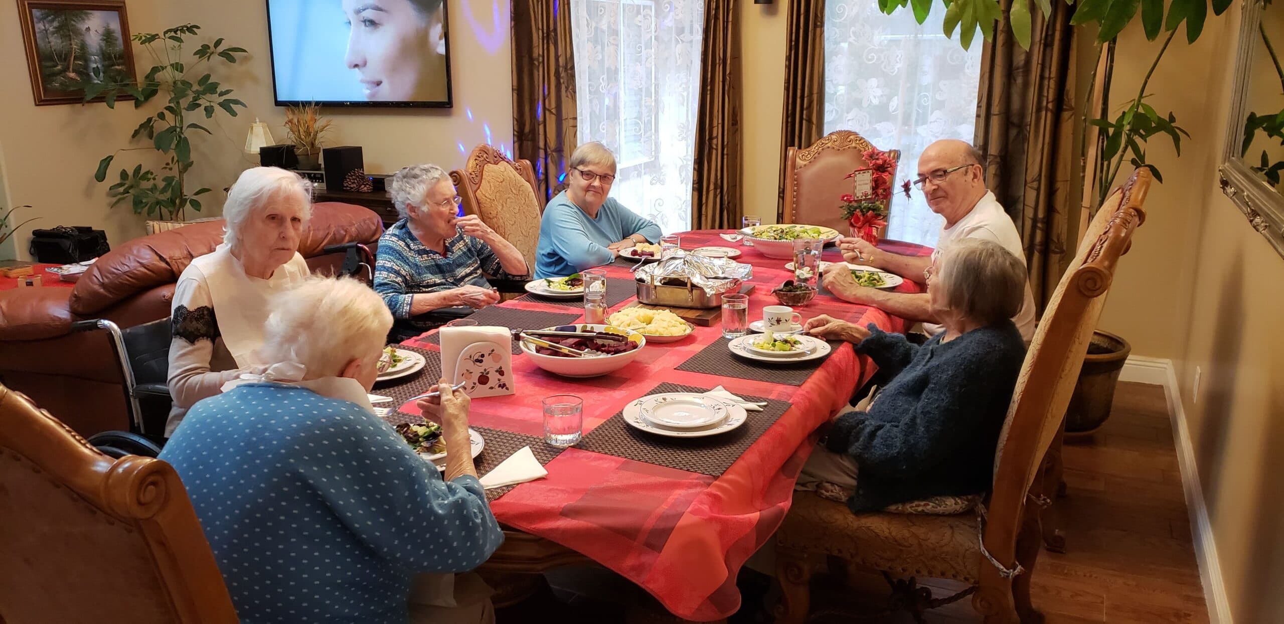 Residents sharing a holiday meal together at The Oaks at Garfield