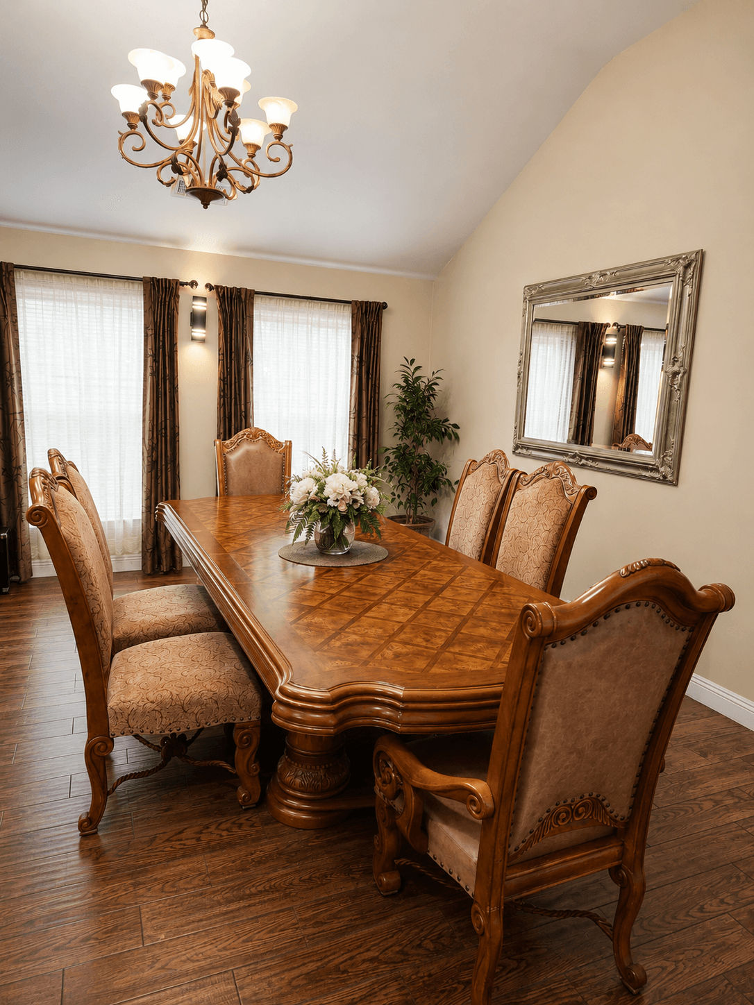 Elegant dining room with chandelier at The Oaks at Garfield Carmichael CA